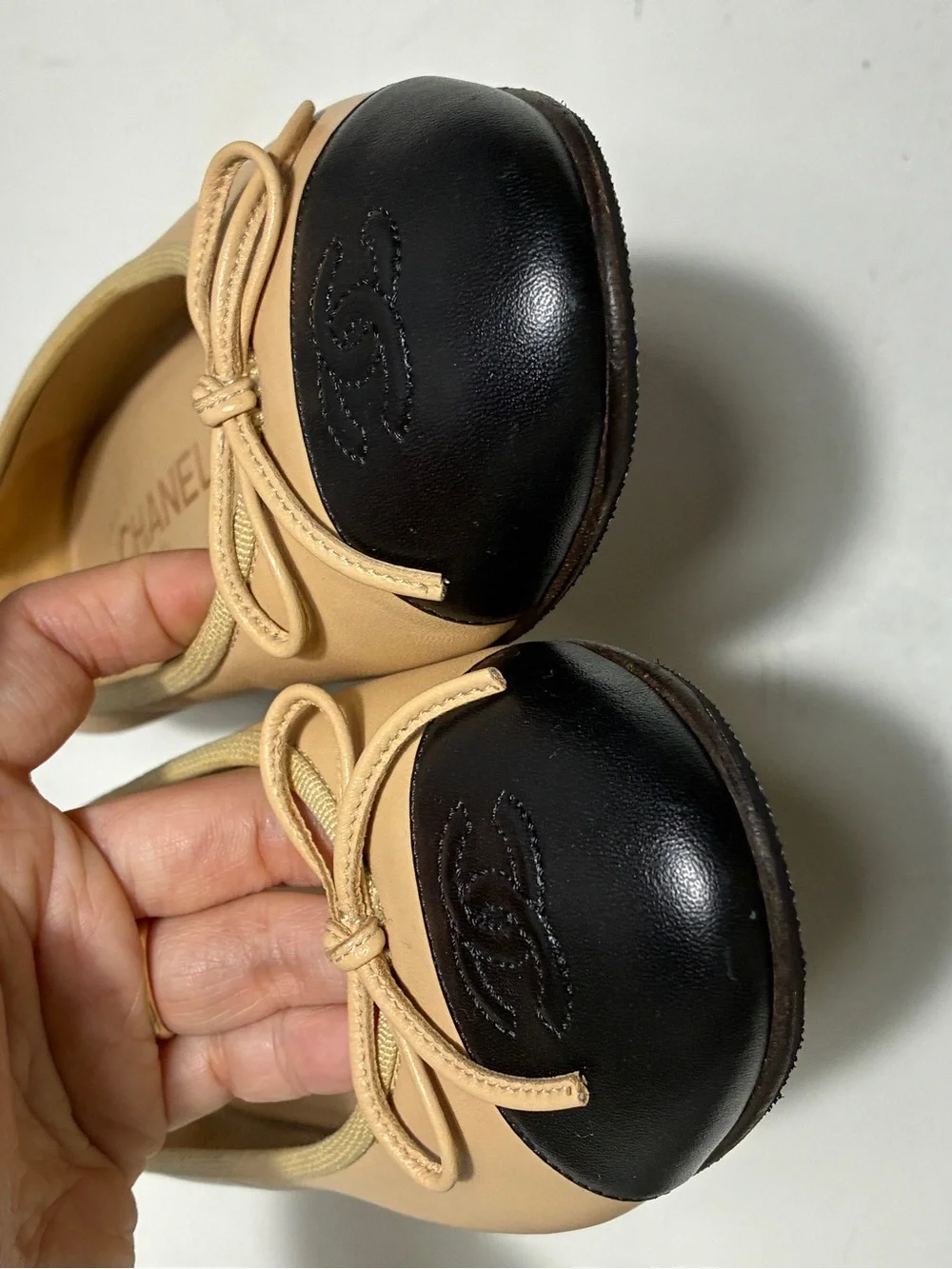 CHANEL Two-Tone Beige and Black Cap-Toe Ballet Flats